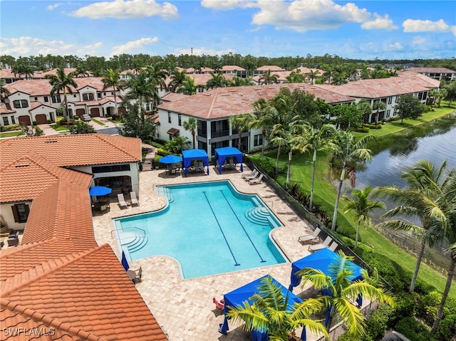 15140 Palmer Lake Cir Unit 201, Naples, FL 34109 - community pool featuring a residential view, a patio, and a water view