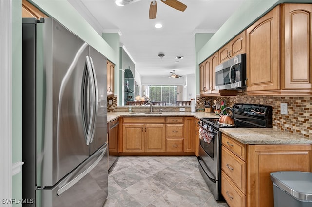 8014 Kilkenny Ct Unit G47, Naples, FL 34112 - kitchen with stainless steel appliances, a ceiling fan, decorative backsplash, light stone counters, and crown molding