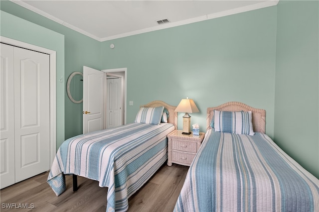 8014 Kilkenny Ct Unit G47, Naples, FL 34112 - bedroom featuring wood finished floors and crown molding