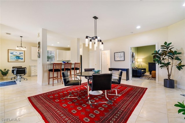4780 Shinnecock Hills Ct Unit 102, Naples, FL 34112 - dining area featuring a chandelier, light tile patterned floors, and recessed lighting
