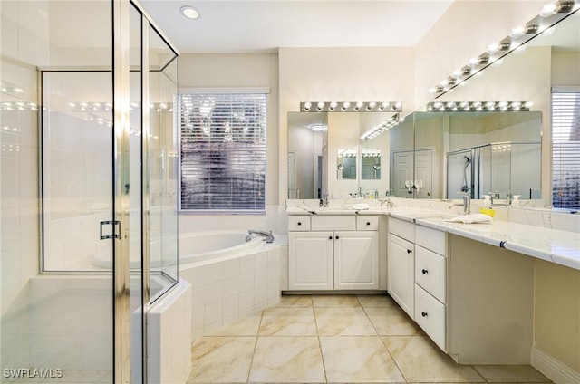 4780 Shinnecock Hills Ct Unit 102, Naples, FL 34112 - full bathroom with a bath, a shower stall, double vanity, and tile patterned flooring