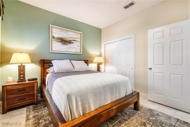 4780 Shinnecock Hills Ct Unit 102, Naples, FL 34112 - bedroom featuring light tile patterned floors and a closet