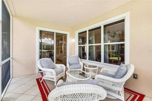 4780 Shinnecock Hills Ct Unit 102, Naples, FL 34112 - sunroom / solarium with a textured wall and tile patterned flooring