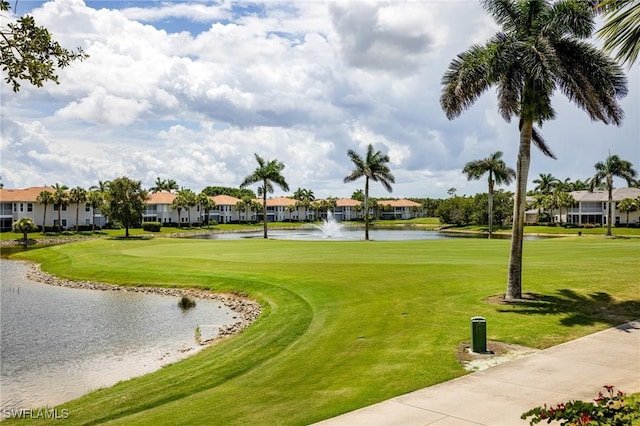 4780 Shinnecock Hills Ct Unit 102, Naples, FL 34112 - view of community featuring a water view, a residential view, a yard, and view of golf course