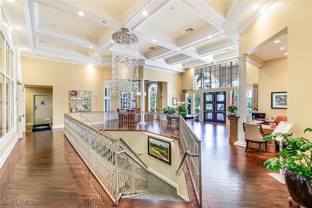 4780 Shinnecock Hills Ct Unit 102, Naples, FL 34112 - community lobby with a towering ceiling, beamed ceiling, coffered ceiling, and recessed lighting