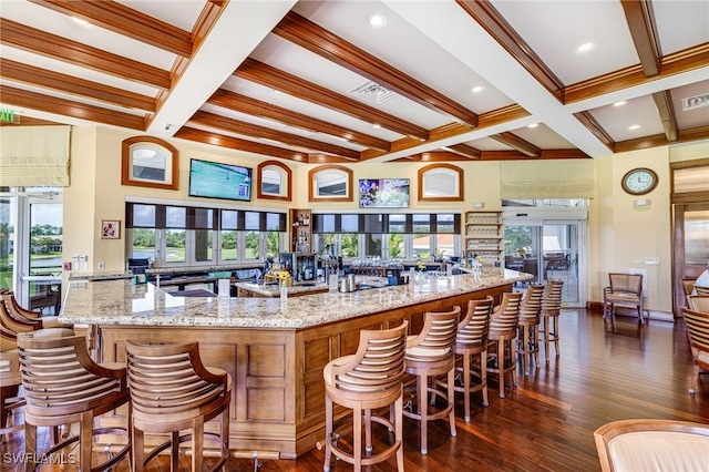 4780 Shinnecock Hills Ct Unit 102, Naples, FL 34112 - kitchen featuring beam ceiling, healthy amount of natural light, dark wood-style floors, coffered ceiling, and light stone countertops