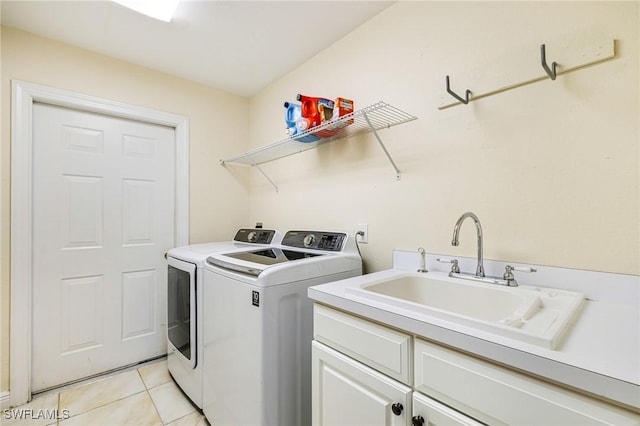 4780 Shinnecock Hills Ct Unit 102, Naples, FL 34112 - laundry area with washing machine and dryer, cabinet space, and light tile patterned flooring