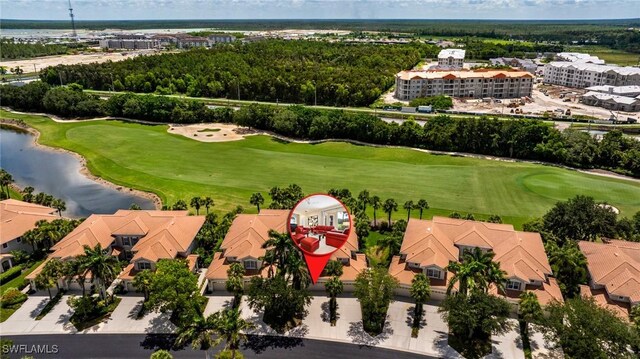 4780 Shinnecock Hills Ct Unit 102, Naples, FL 34112 - drone / aerial view of a golf club and a large body of water