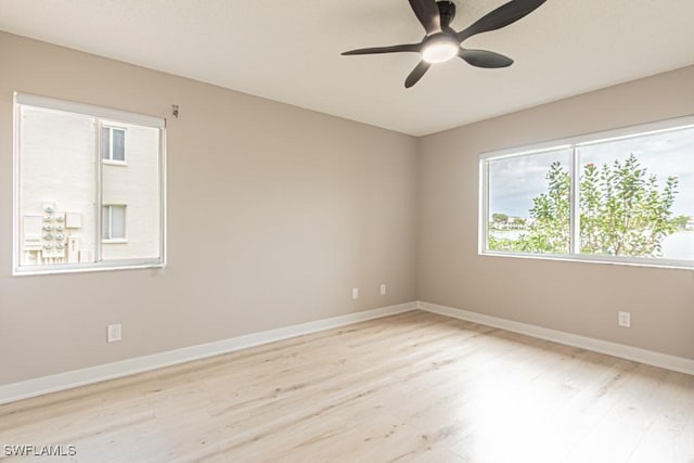 7718 Jewel Ln Unit 101, Naples, FL 34109 - spare room with wood finished floors and ceiling fan
