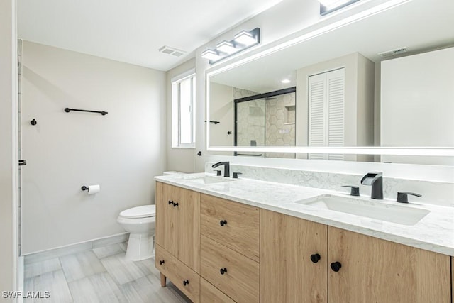 7718 Jewel Ln Unit 101, Naples, FL 34109 - bathroom featuring double vanity and a stall shower
