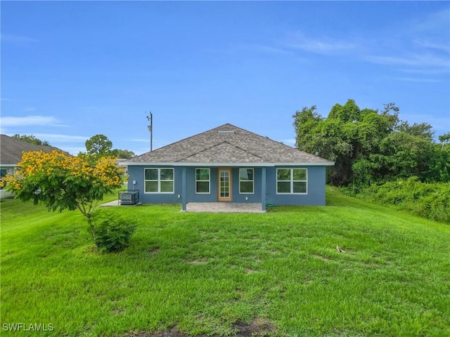2920 6th St SW, Lehigh Acres, FL 33976 - view of front facade featuring a patio area, stucco siding, and a front yard