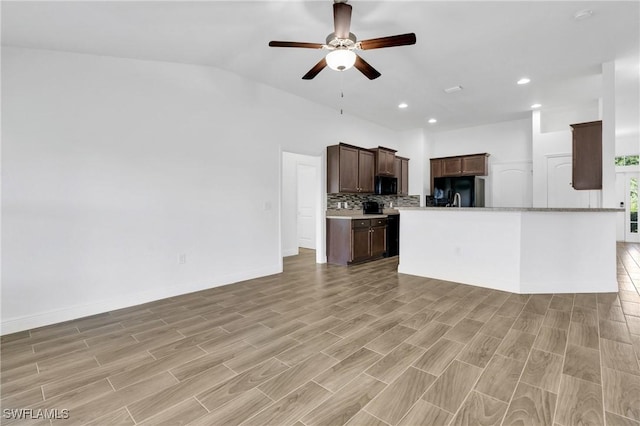 2920 6th St SW, Lehigh Acres, FL 33976 - unfurnished living room with ceiling fan, recessed lighting, light wood finished floors, and lofted ceiling