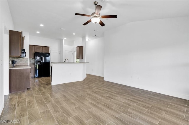 2920 6th St SW, Lehigh Acres, FL 33976 - unfurnished living room with a ceiling fan, light wood-style floors, recessed lighting, and lofted ceiling
