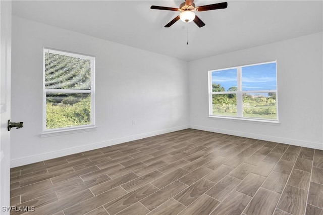 2920 6th St SW, Lehigh Acres, FL 33976 - empty room featuring wood finished floors and ceiling fan