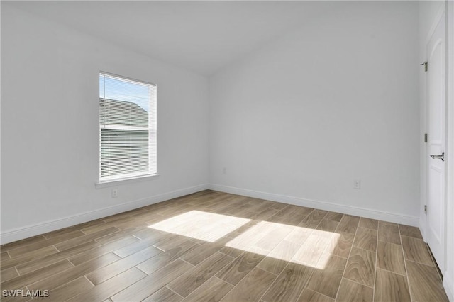 2920 6th St SW, Lehigh Acres, FL 33976 - spare room featuring wood finished floors and baseboards