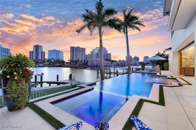 309 Neapolitan Way, Naples, FL 34103 - view of pool featuring a skyline view, a boat dock, a pool with connected hot tub, and a water view