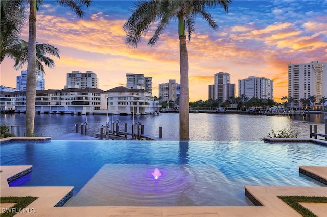 309 Neapolitan Way, Naples, FL 34103 - view of swimming pool with boat lift, a water view, a dock, and a view of skyline