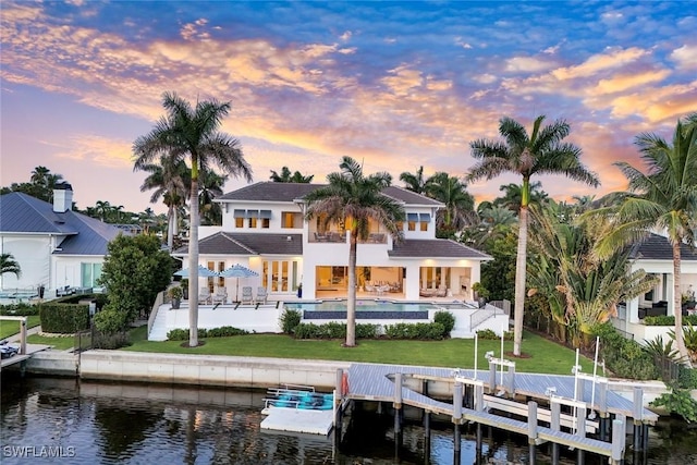 309 Neapolitan Way, Naples, FL 34103 - rear view of property with a water view, an outdoor pool, a patio, and boat lift
