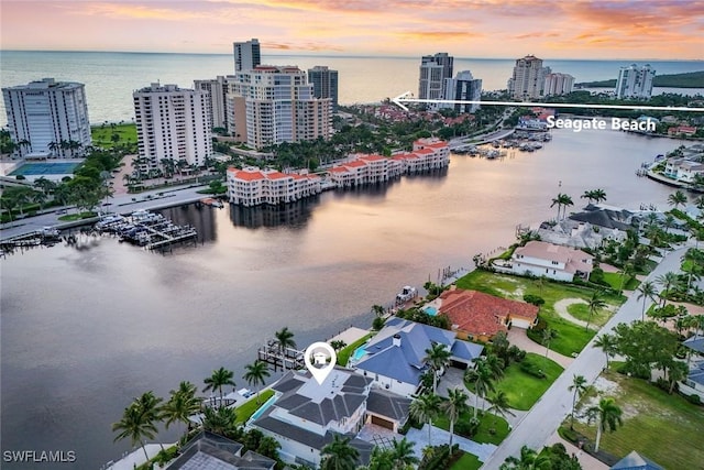 309 Neapolitan Way, Naples, FL 34103 - aerial view at dusk of a water view and a view of city