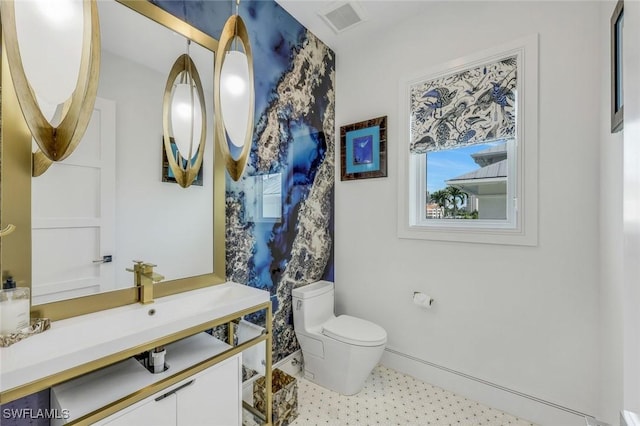 309 Neapolitan Way, Naples, FL 34103 - half bathroom featuring toilet and tile patterned floors