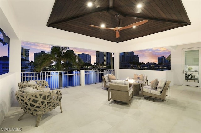 309 Neapolitan Way, Naples, FL 34103 - view of patio featuring an outdoor living space with a fire pit and a view of city