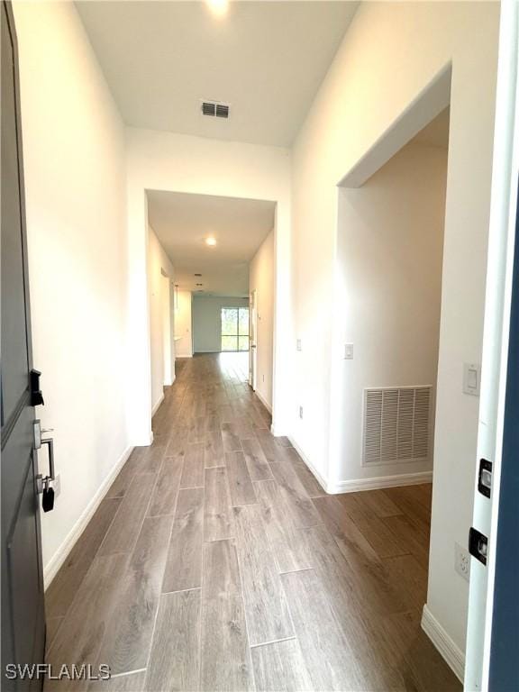 2667 Scarlet Way, Naples, FL 34120 - hallway with wood finished floors and baseboards