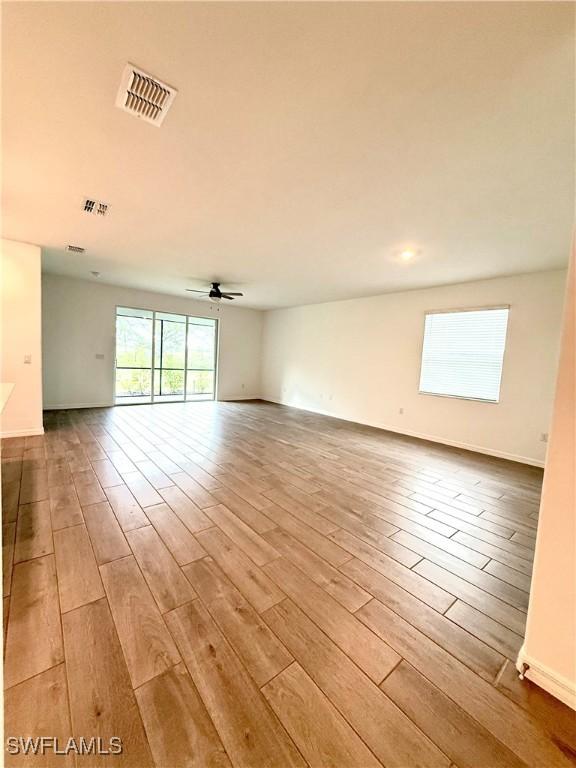 2667 Scarlet Way, Naples, FL 34120 - spare room featuring wood finished floors and a ceiling fan