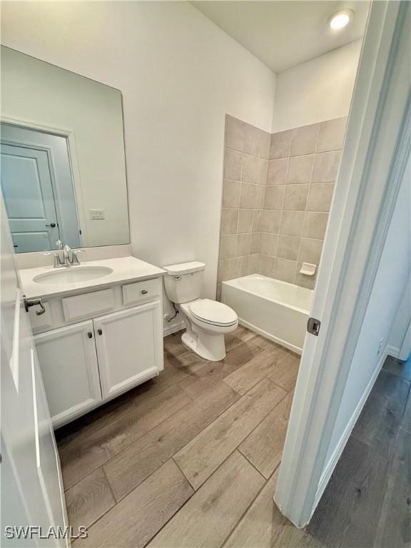 2667 Scarlet Way, Naples, FL 34120 - full bath featuring wood finished floors, vanity, and a tub