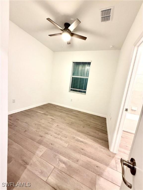 2667 Scarlet Way, Naples, FL 34120 - empty room featuring wood finished floors and ceiling fan