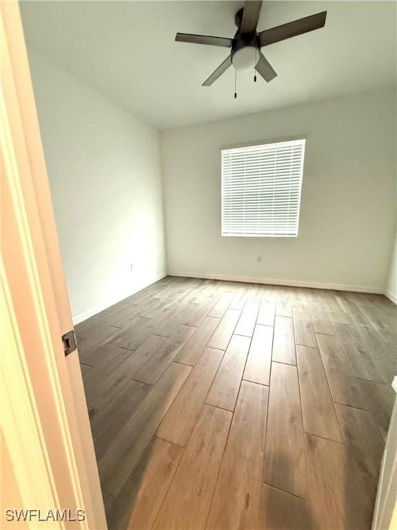 2667 Scarlet Way, Naples, FL 34120 - empty room with wood finished floors and ceiling fan