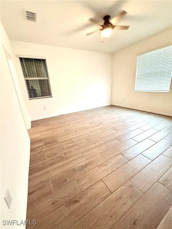 2667 Scarlet Way, Naples, FL 34120 - unfurnished room with wood finished floors and a ceiling fan