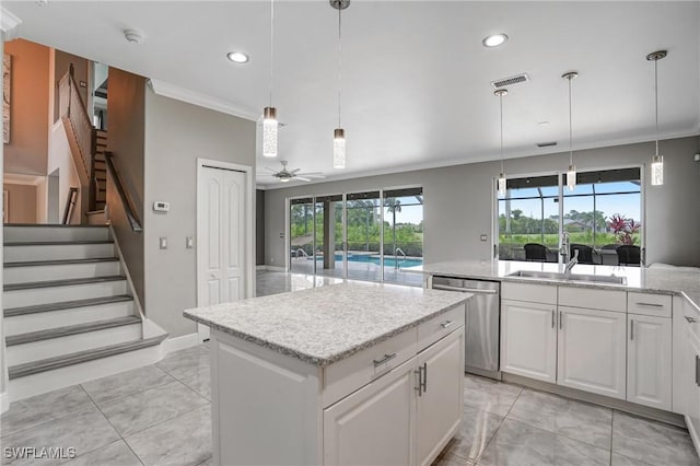 4582 Fairloop Run, Lehigh Acres, FL 33973 - kitchen featuring stainless steel dishwasher, crown molding, a kitchen island, ceiling fan, and recessed lighting