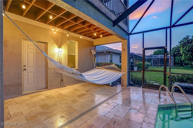 4582 Fairloop Run, Lehigh Acres, FL 33973 - patio terrace at dusk with a patio area, a lanai, and a pool