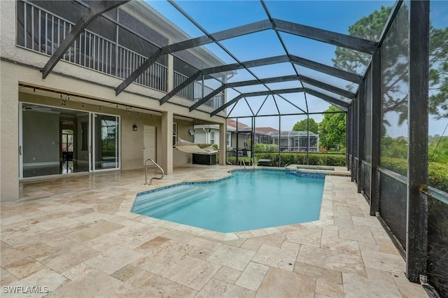 4582 Fairloop Run, Lehigh Acres, FL 33973 - view of pool featuring a pool with connected hot tub, a patio area, and glass enclosure