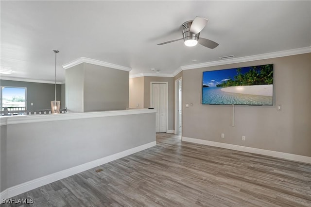 4582 Fairloop Run, Lehigh Acres, FL 33973 - spare room featuring ornamental molding, wood finished floors, and a ceiling fan