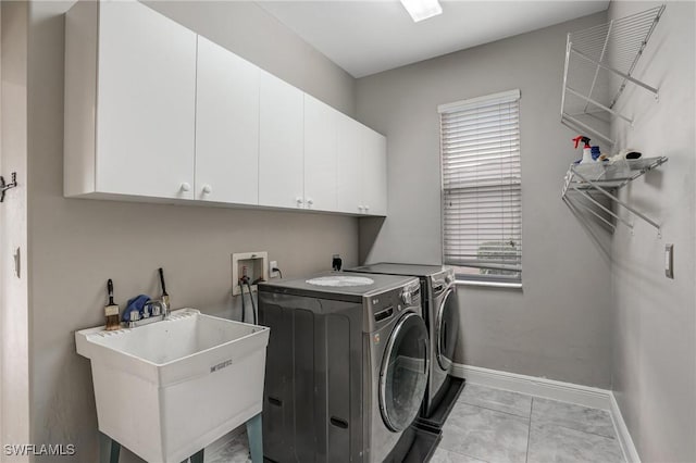 4582 Fairloop Run, Lehigh Acres, FL 33973 - laundry area featuring cabinet space, separate washer and dryer, and light marble finish floors