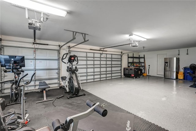 4582 Fairloop Run, Lehigh Acres, FL 33973 - garage featuring stainless steel refrigerator with ice dispenser and a garage door opener