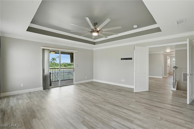 4582 Fairloop Run, Lehigh Acres, FL 33973 - unfurnished room featuring a raised ceiling, ceiling fan, light wood-style flooring, crown molding, and a smoke detector