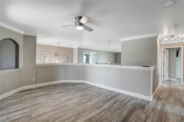 4582 Fairloop Run, Lehigh Acres, FL 33973 - unfurnished room with crown molding, ceiling fan, and wood finished floors