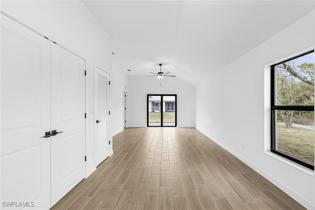 804 Gen D Macarthur Ave, Labelle, FL 33935 - empty room with a ceiling fan, vaulted ceiling, and light wood finished floors