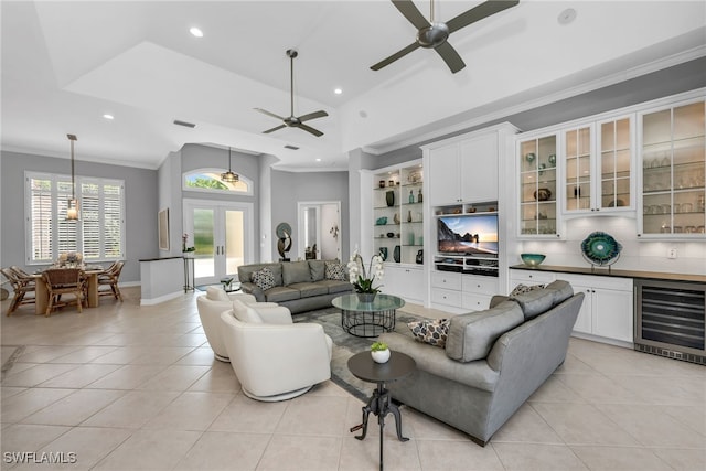 3262 Sedge Pl, Naples, FL 34105 - living room featuring beverage cooler, ornamental molding, a ceiling fan, light tile patterned floors, and recessed lighting