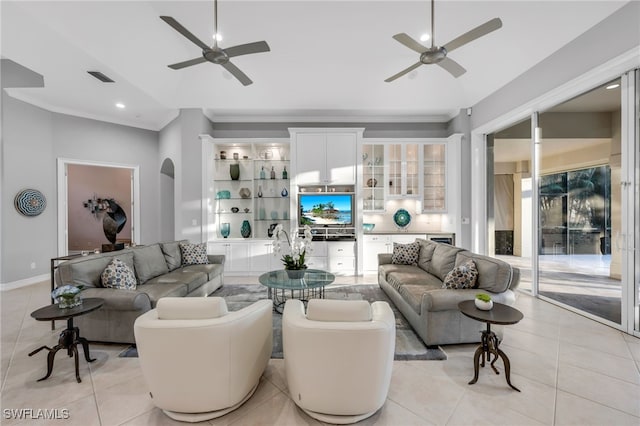 3262 Sedge Pl, Naples, FL 34105 - living room with a ceiling fan, light tile patterned flooring, crown molding, recessed lighting, and arched walkways