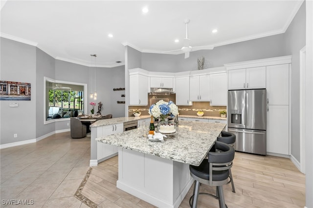 3262 Sedge Pl, Naples, FL 34105 - kitchen featuring stainless steel fridge with ice dispenser, backsplash, under cabinet range hood, white cabinetry, and recessed lighting