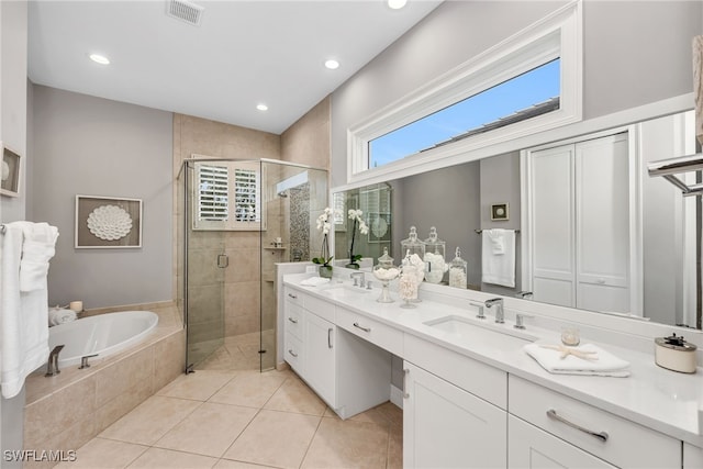 3262 Sedge Pl, Naples, FL 34105 - bathroom with double vanity, a stall shower, a garden tub, tile patterned floors, and recessed lighting