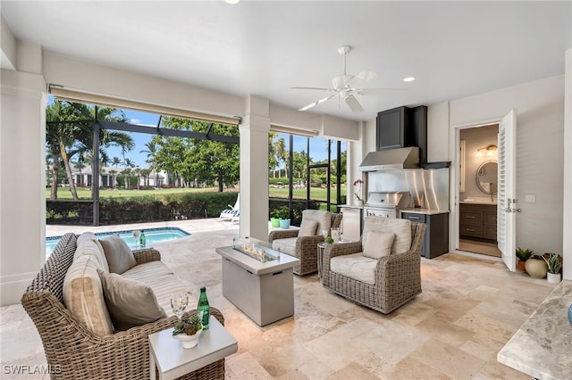 3262 Sedge Pl, Naples, FL 34105 - view of patio / terrace featuring exterior kitchen, an outdoor pool, an outdoor living space with a fire pit, a ceiling fan, and a lanai