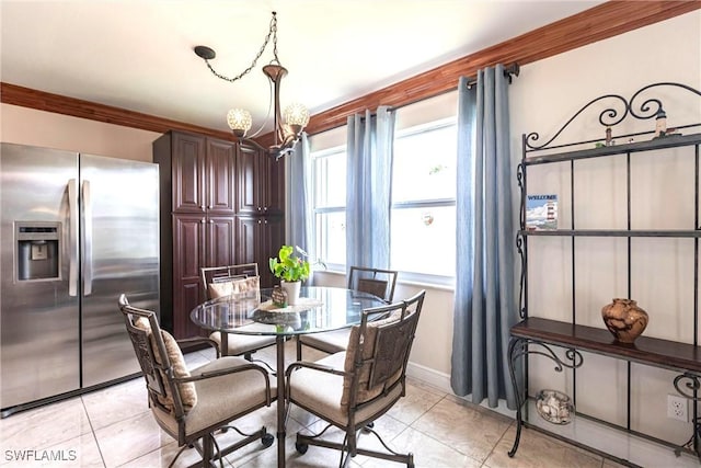 401 NE 14th Pl, Cape Coral, FL 33909 - dining room with a chandelier and light tile patterned floors