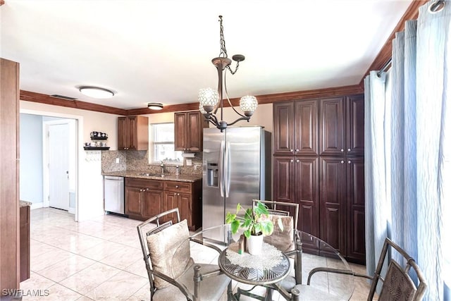 401 NE 14th Pl, Cape Coral, FL 33909 - dining space with a chandelier