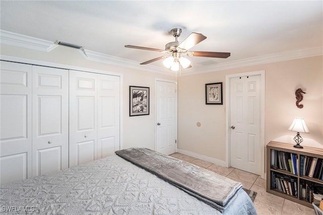 401 NE 14th Pl, Cape Coral, FL 33909 - bedroom with ornamental molding, a closet, a ceiling fan, and light tile patterned flooring