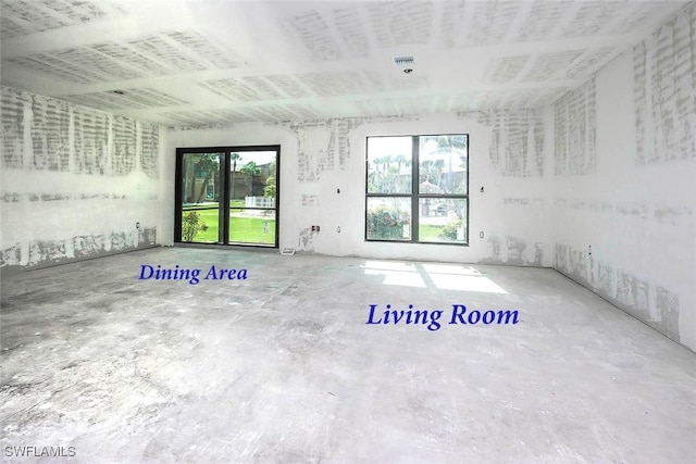 5117 Sea Bell Rd Unit B109, Sanibel, FL 33957 - empty room with healthy amount of natural light and unfinished concrete floors