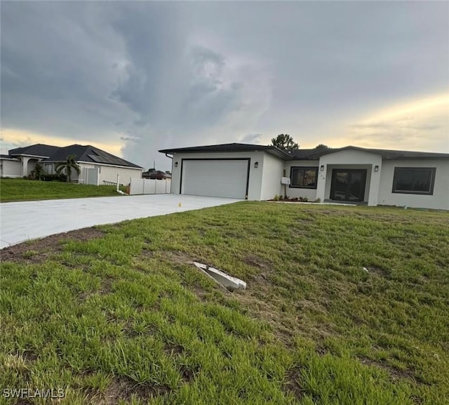 714 Euston Ave S, Lehigh Acres, FL 33974 - ranch-style home featuring concrete driveway, a garage, and stucco siding